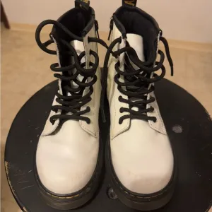 Great condition DR. Marten’s, white leather, lace up, with side zipper.